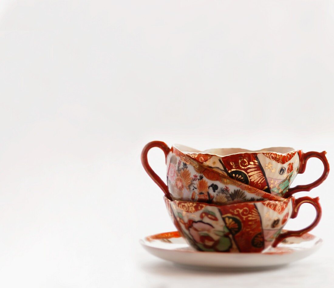 A stack of three vintage porcelain cups