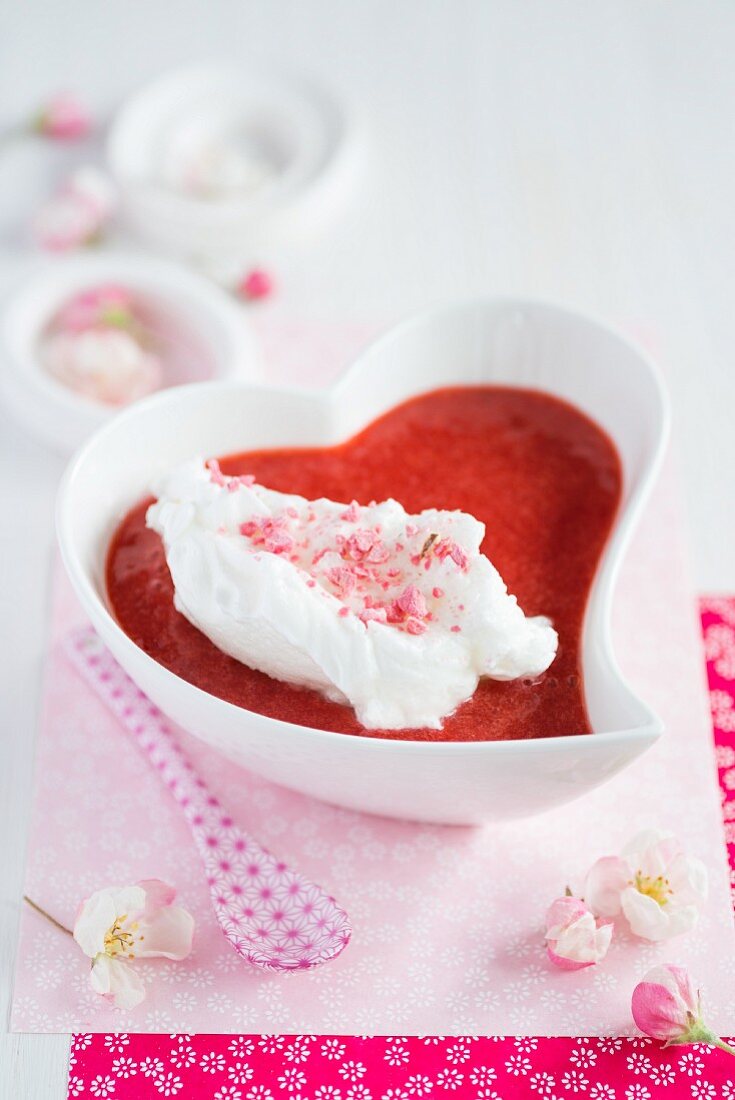 A floating island with strawberry sauce
