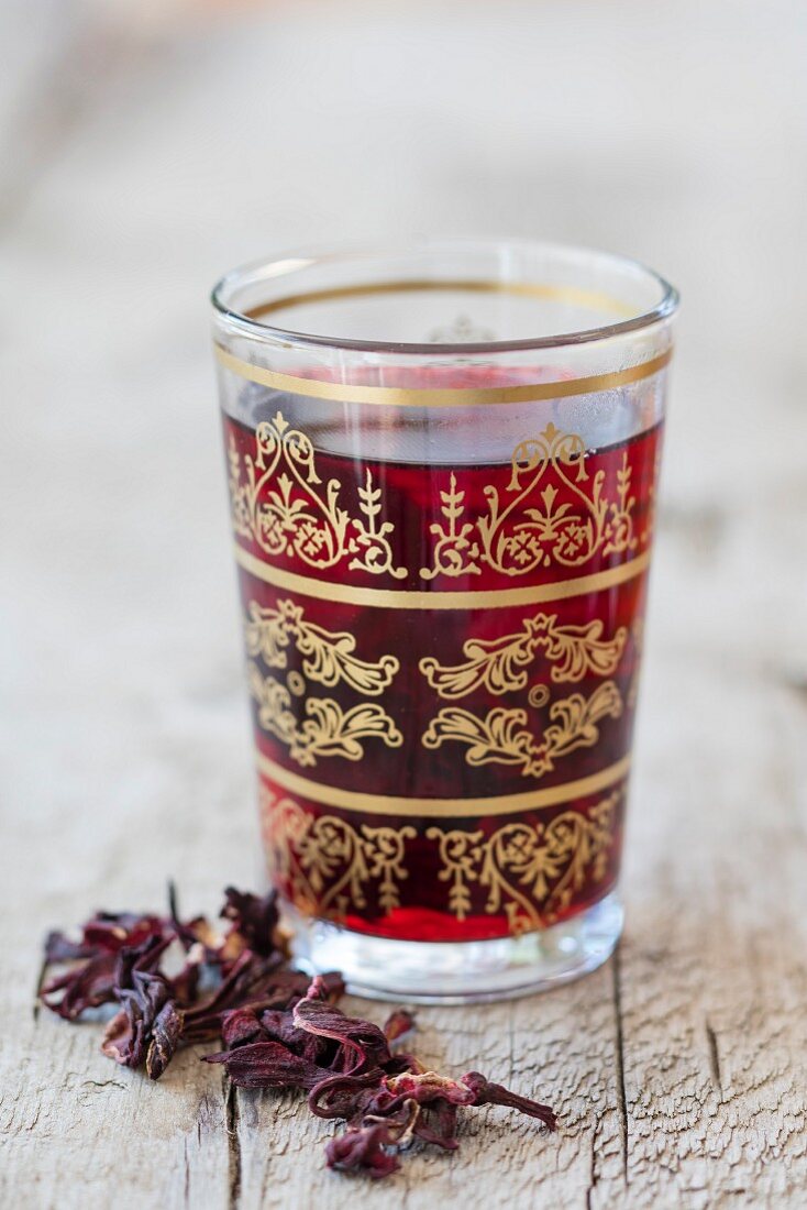 Hibiscus flower tea in an oriental tea glass