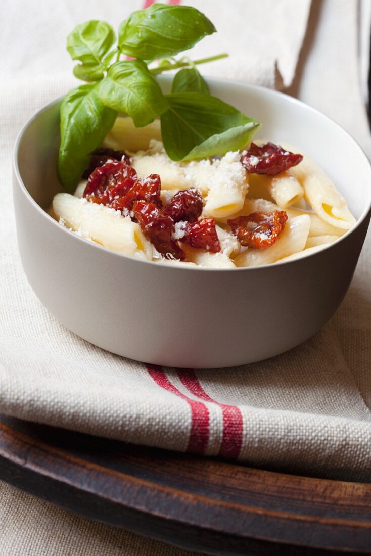 Penne pasta with dried tomatoes, basil and Parmesan cheese