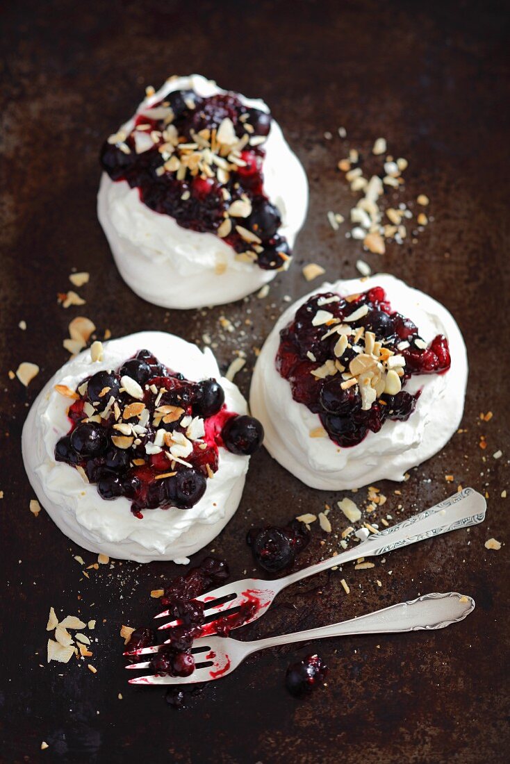 Mini pavlovas with berries and almonds