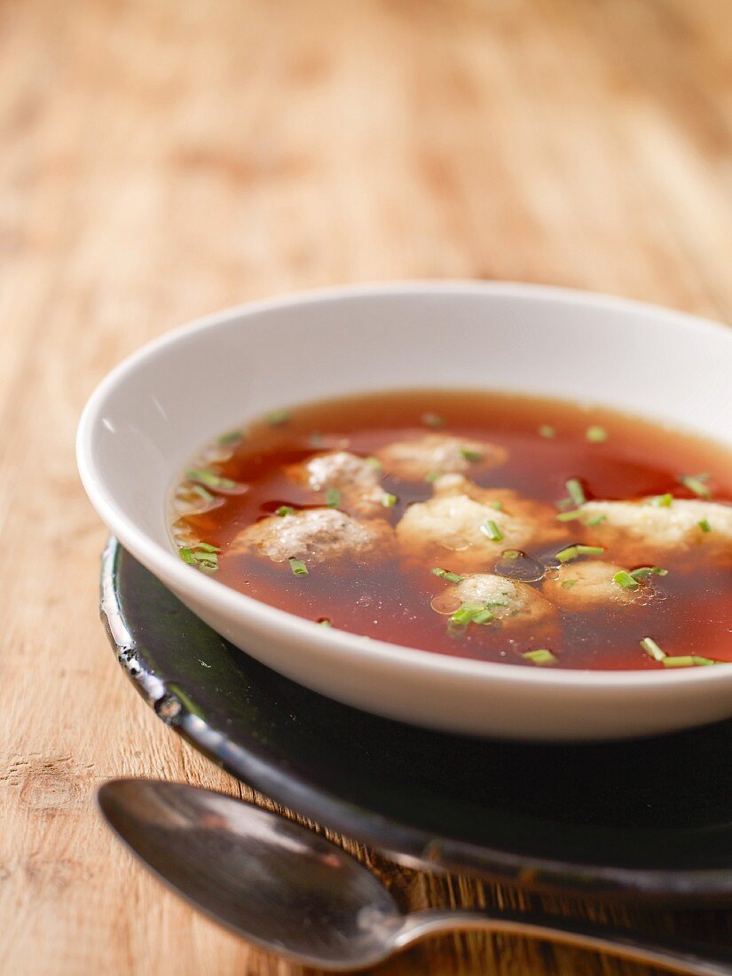 Festive beef broth with soup dumplings