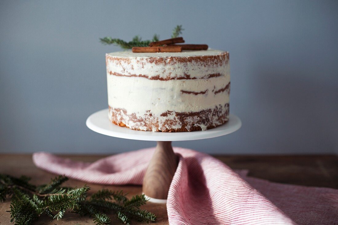 A winter eggnog cake on a cake stand