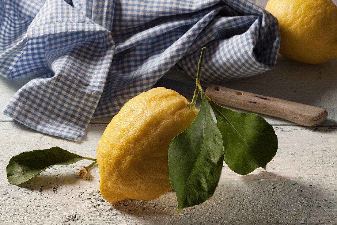 A fresh lemon with a leaf