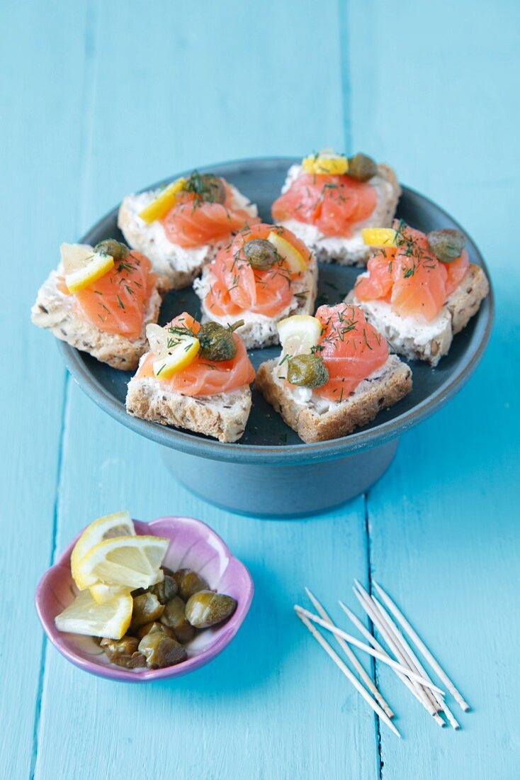 Mini canapes with smoked salmon and capers