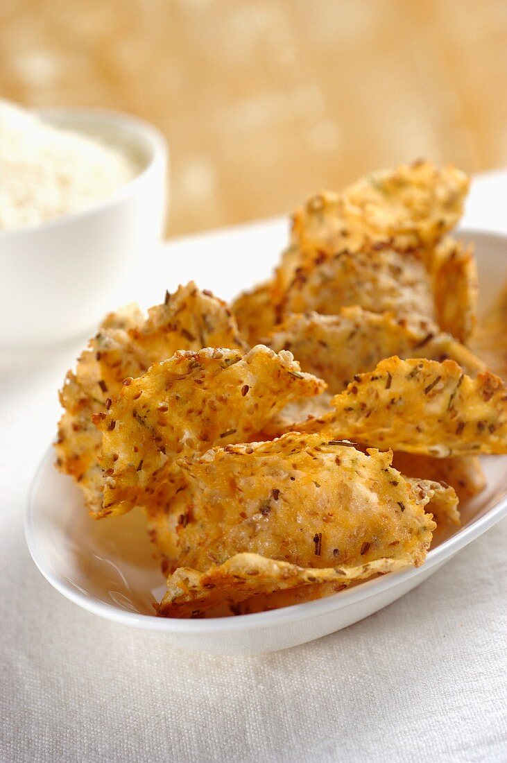 Parmesan crisps with sesame seeds and rosemary