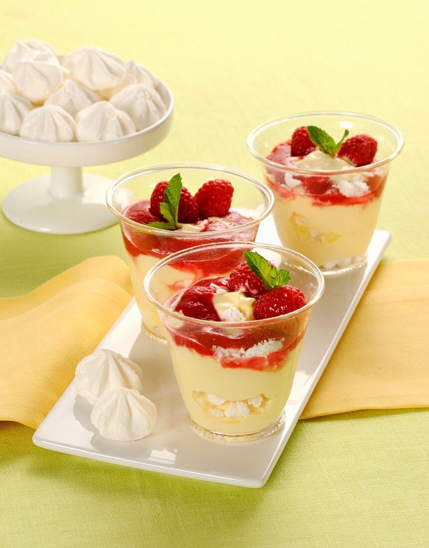Raspberry desserts with cream and meringue