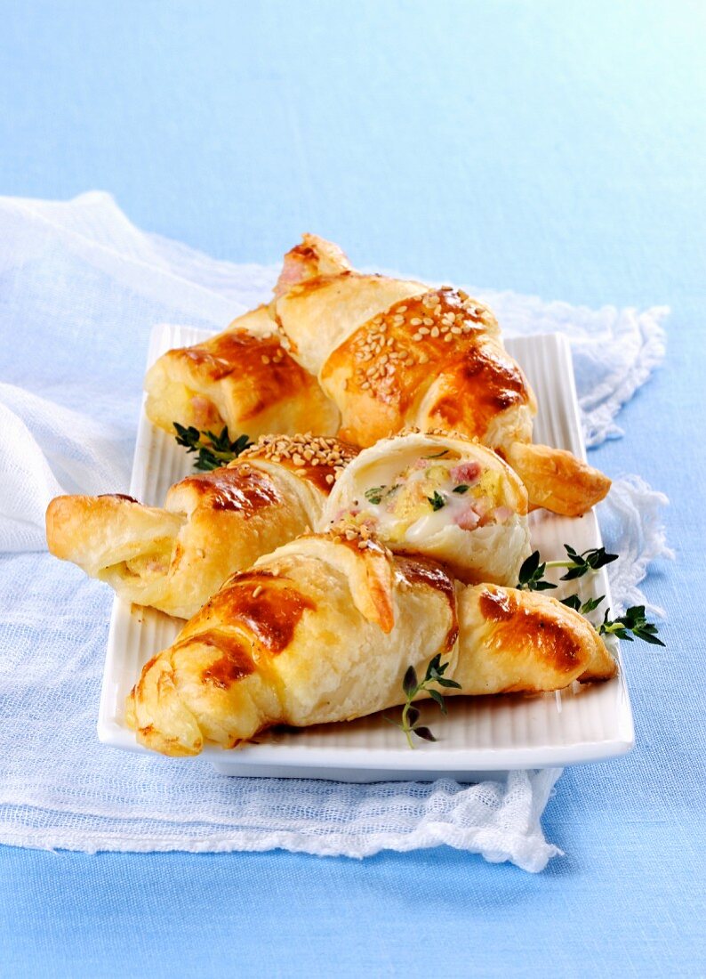 Ham and cheese croissants with sesame seeds