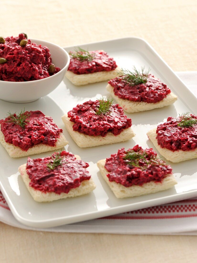 Crostini topped with a beetroot spread
