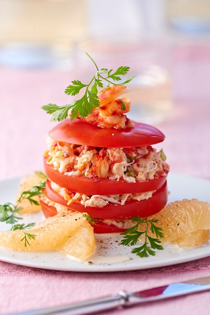 A tomato tower with grapefruit and crab meat