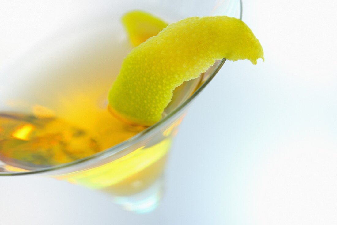 Cactus Sour cocktail with lemon zest
