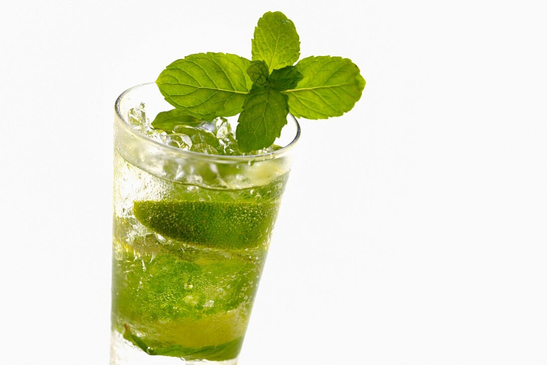 Mojito with lime slices and mint