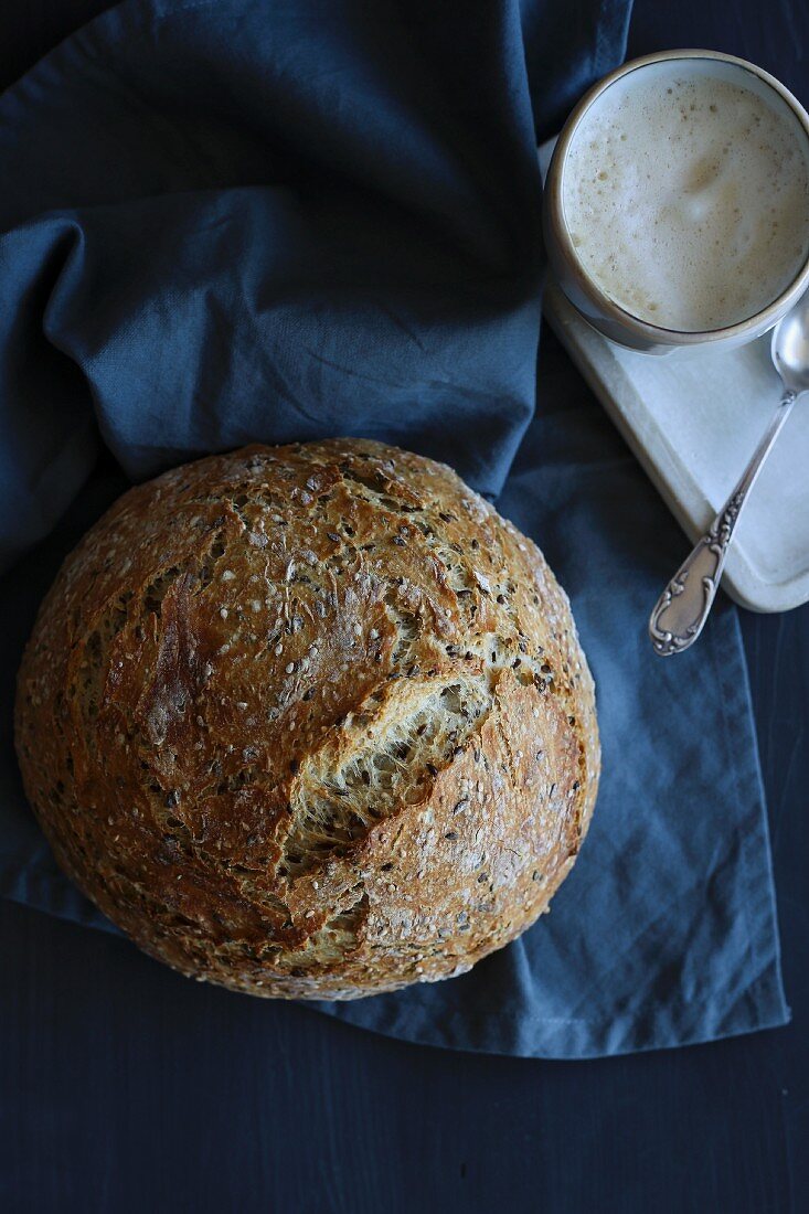 Freshly baked grain bread and cappuccino