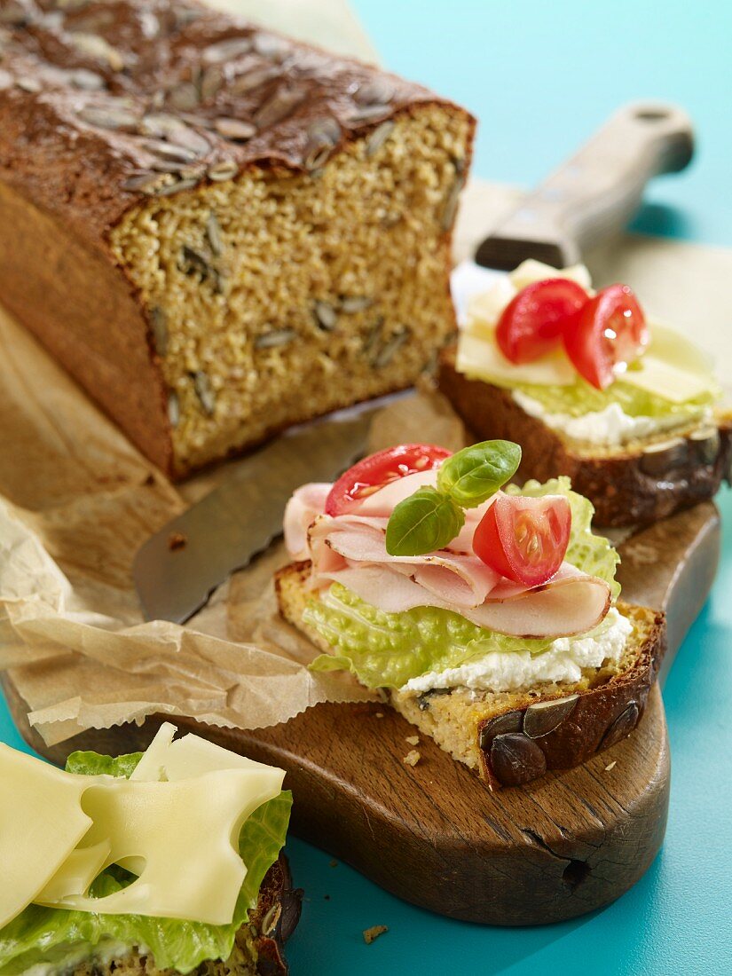 Slices of pumpkin seed and quark bread with a savoury topping