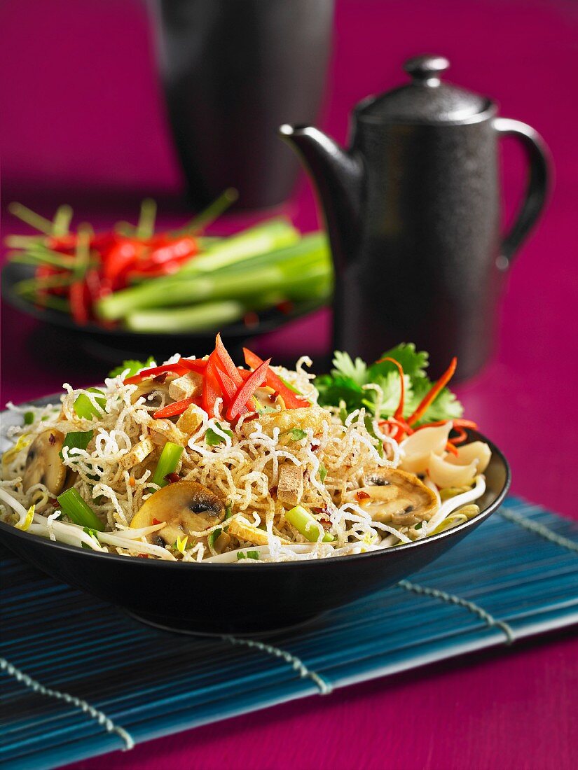 Thai noodles with mushrooms, beansprouts, chilli and spring onions