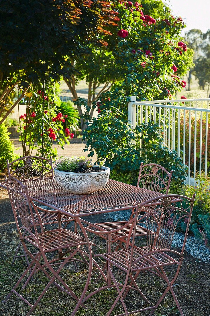 Garden furniture made of metal in the summer garden