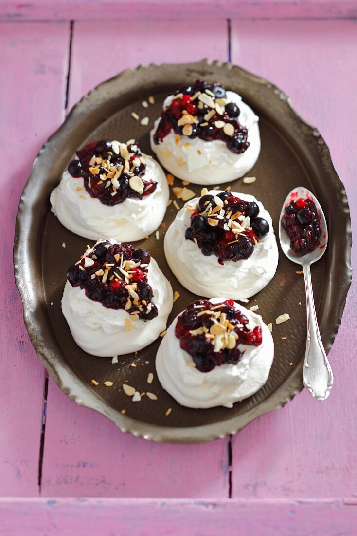 Meringues with whipped cream and berry compote