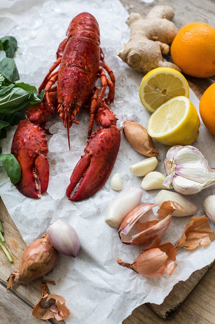 Cooked lobster and various ingredients on a piece of paper