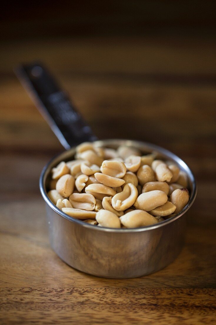 Peanuts in a measuring cup