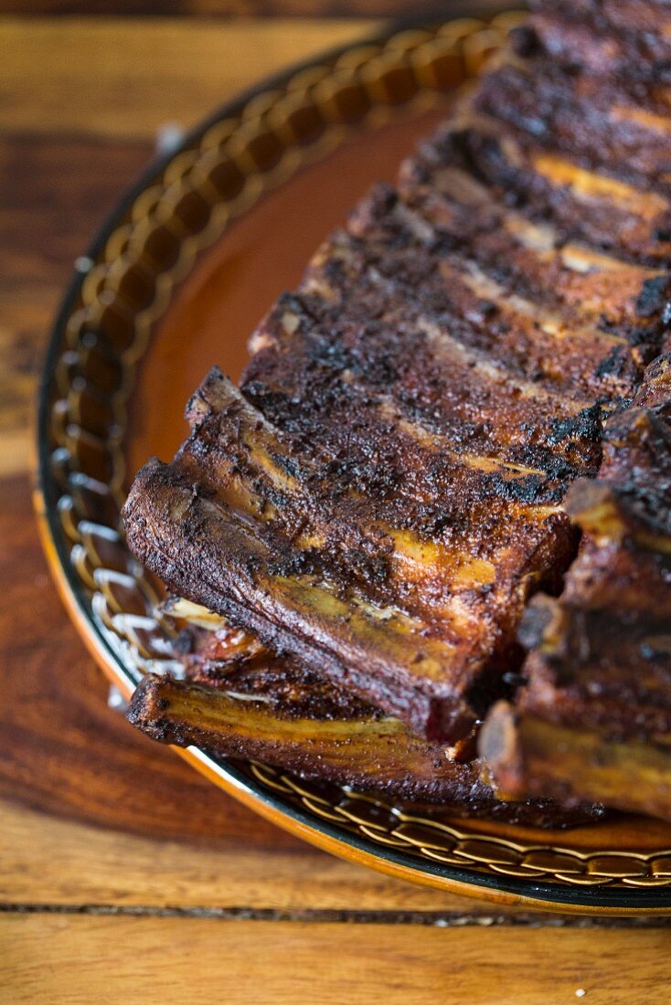 Grilled spare ribs on a rustic plate