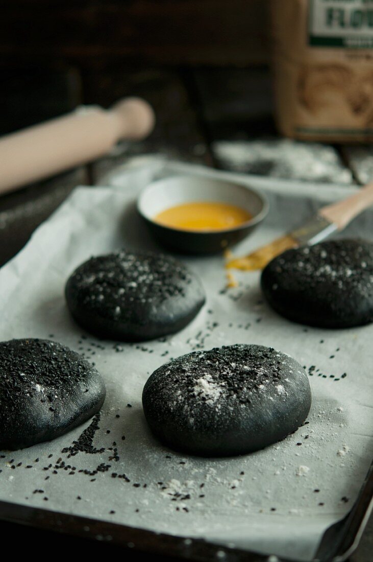 Black hamburger buns coloured with squid ink