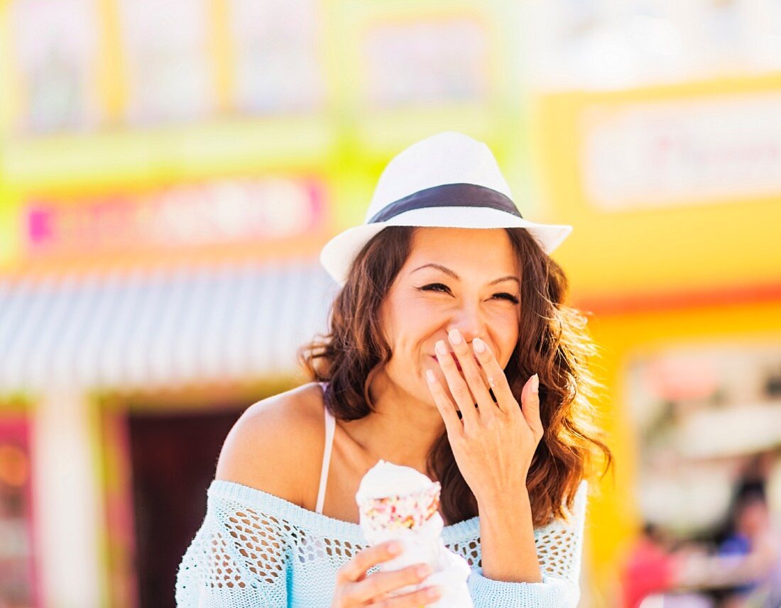 An Oriental woman eating ice cream