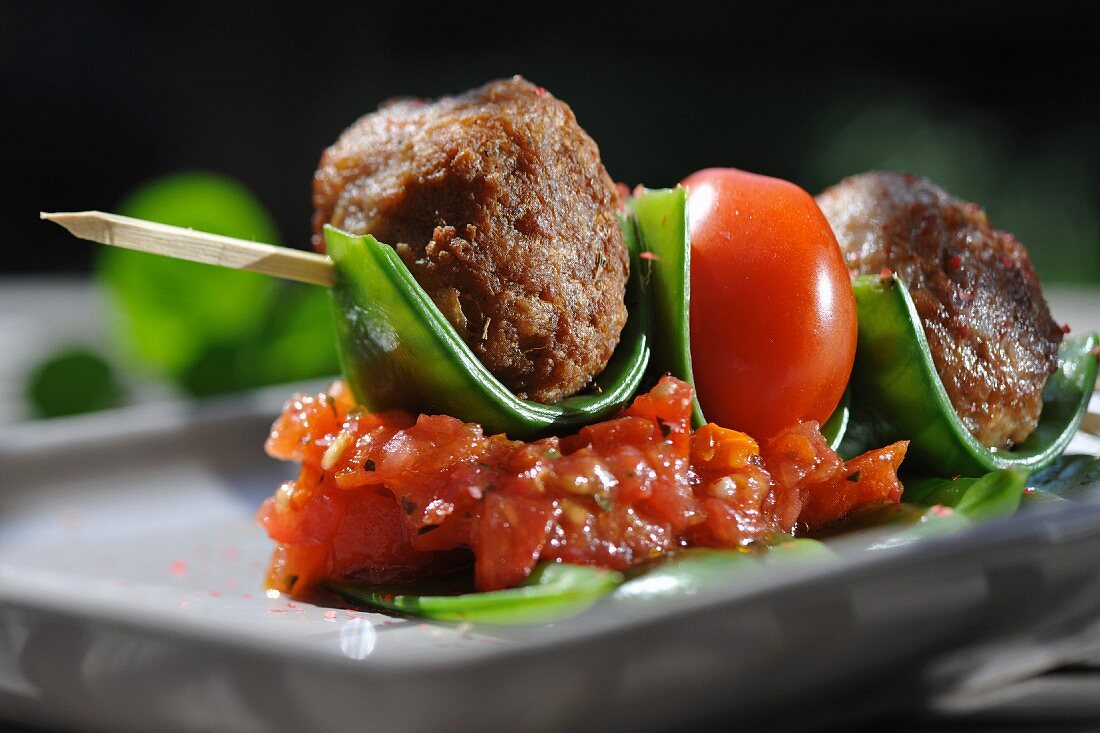 Meatballs with tomatoes on sticks
