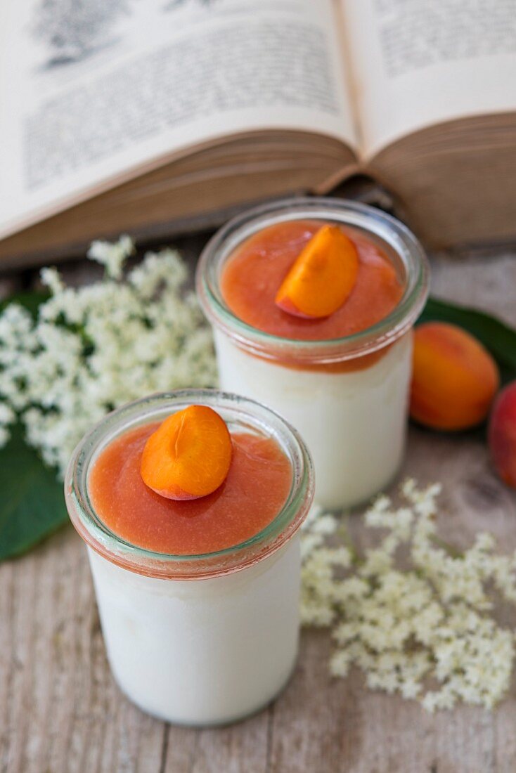 Ice cream parfait with elderflower syrup and apricots