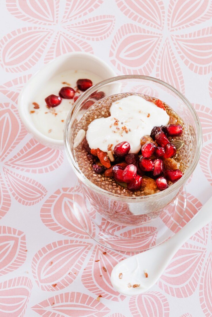 Chia pudding with pomegranate seeds and muesli