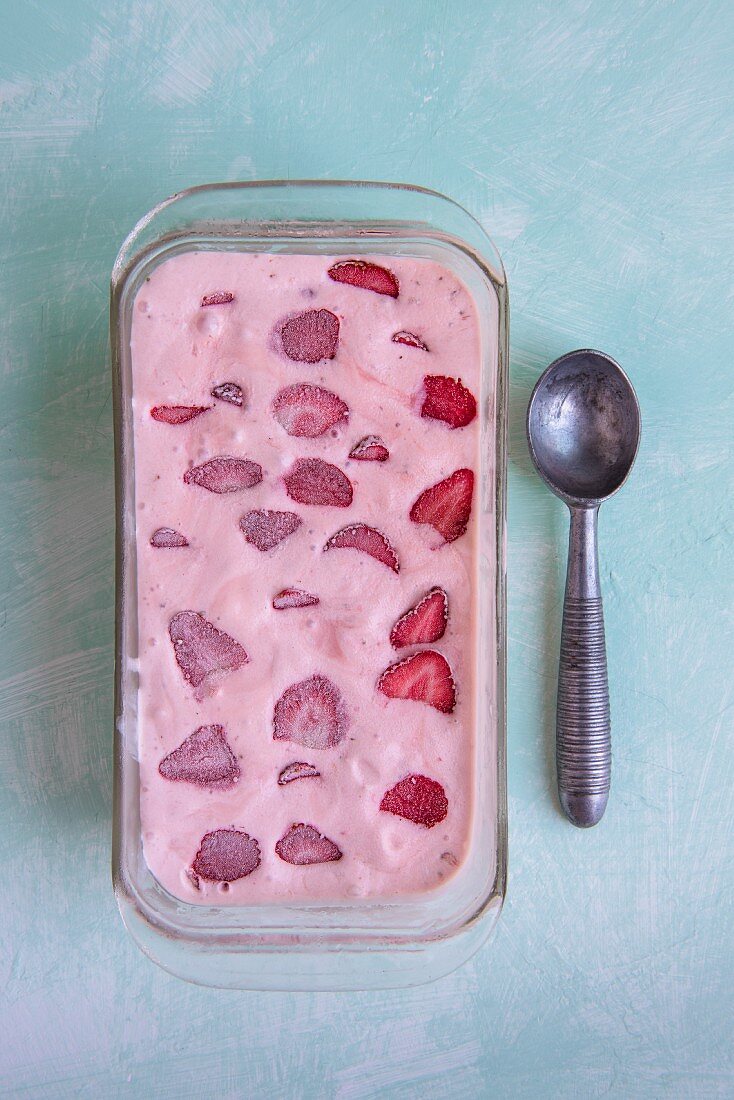 Homemade strawberry ice cream in a glass dish (seen above)