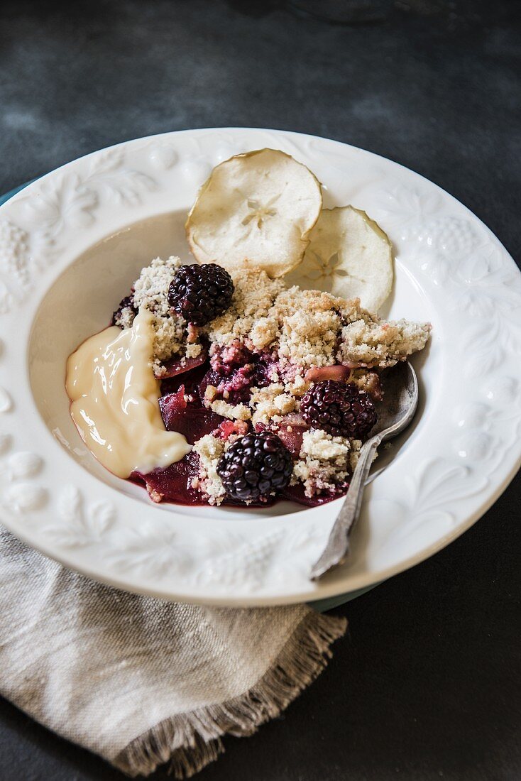 Blackberry and apple crumble served with custard