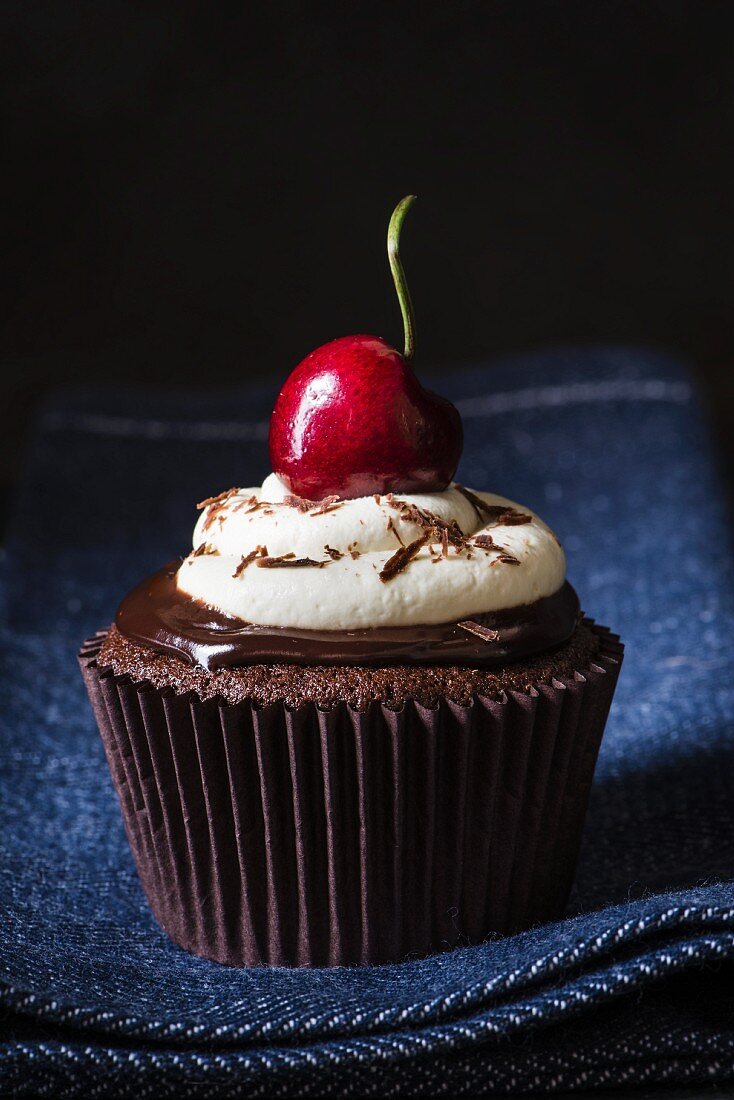 Black Forest cherry cupcake with ganache, cream and cherries