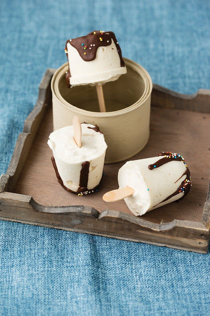 Homemade vanilla ice cream sticks with chocolate glaze