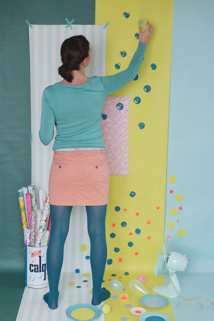 Brightening up wallpaper and gift wrap with colourful spots of paint