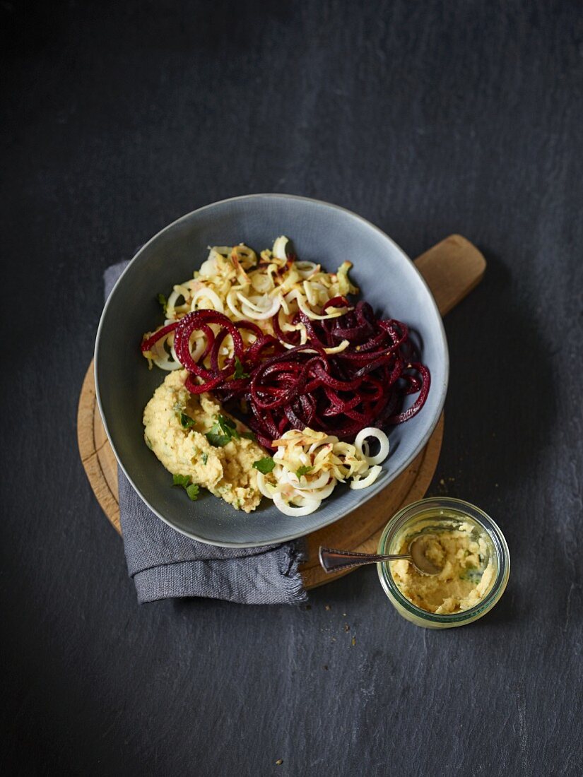 Roasted beetroot and parsnip spirals with hummus