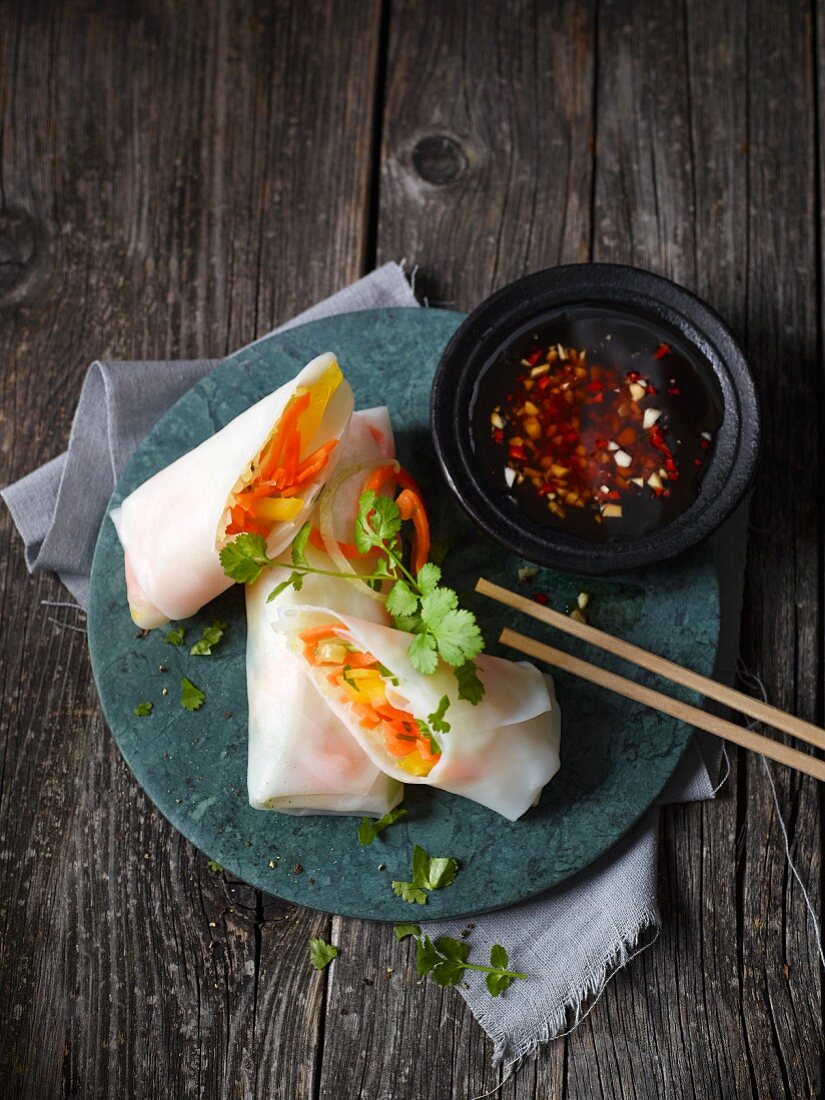 Vietnamese rolls filled with vegetables served with chilli sauce
