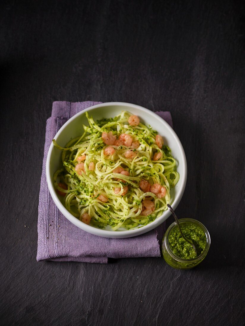 Celery spaghetti with rocket pesto and shrimps