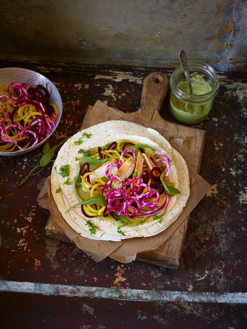 Tortillas with colourful beetroot spirals and chicken breast