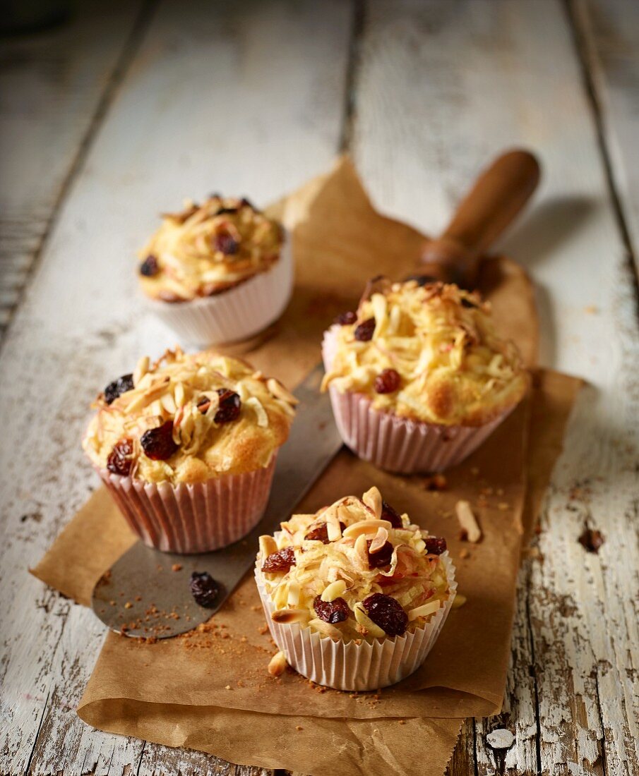 Baked apple nests made from apple spirals with almonds and raisins