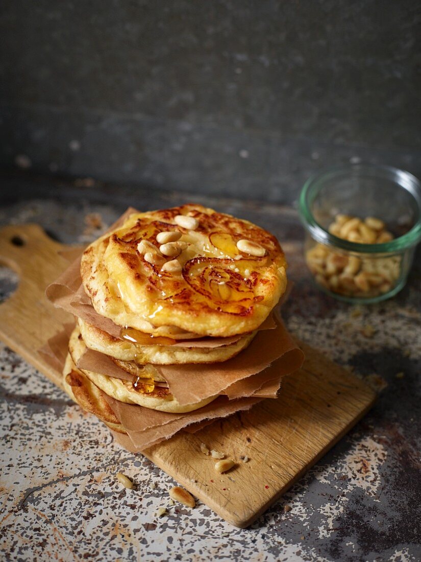 Pancakes with quince spirals and pine nuts