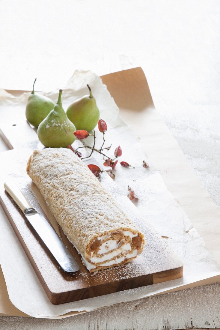 An autumnal Swiss roll with pears and cream