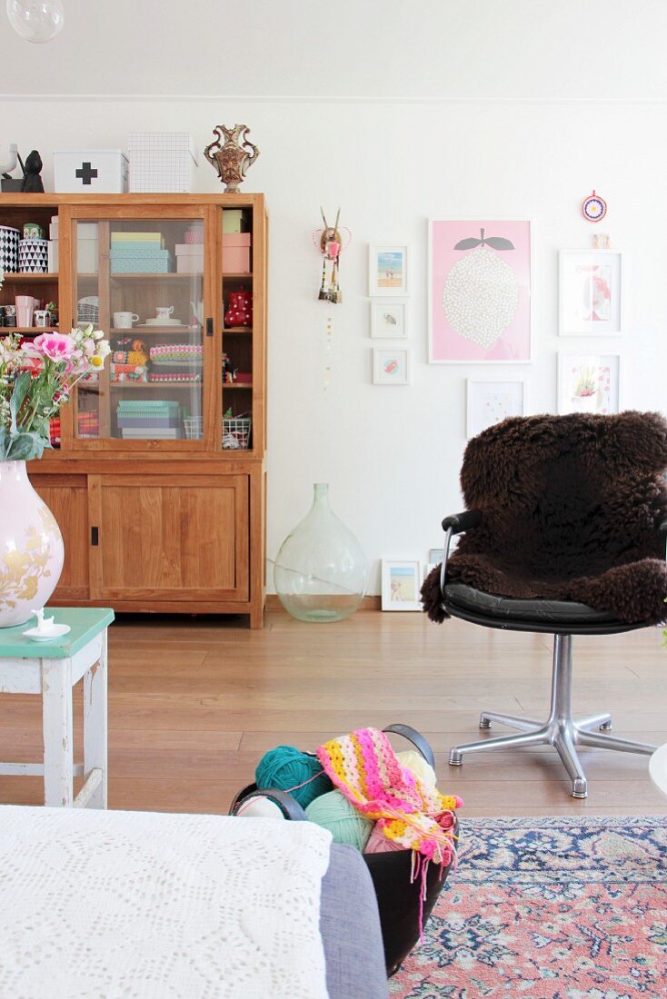 Plain wooden dresser with sliding doors in retro interior