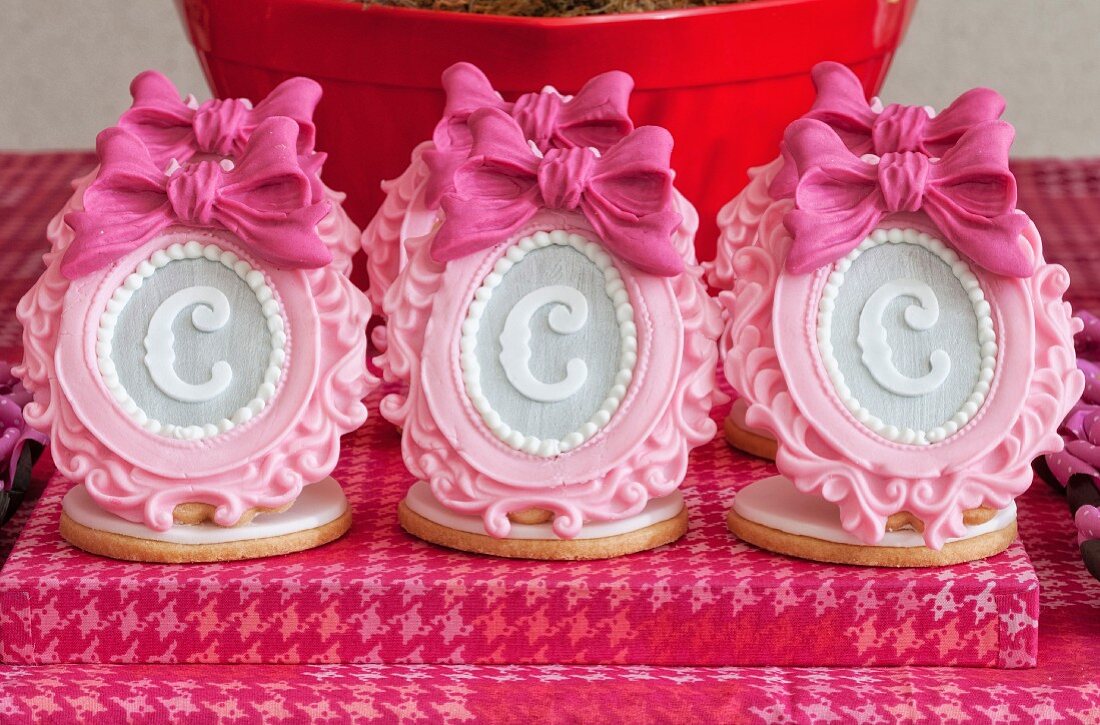 Elaborate sugar decorations with letters on shortbread biscuits