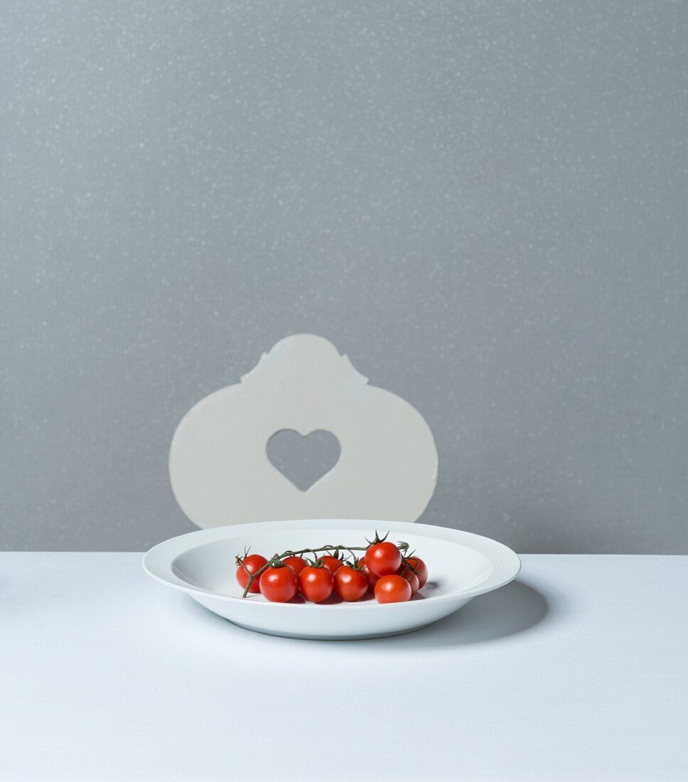 Vine tomatoes on a porcelain plate