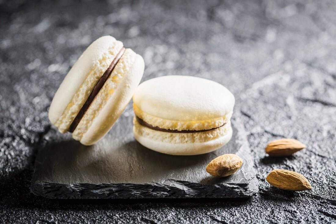 Almond macaroons on a black stone