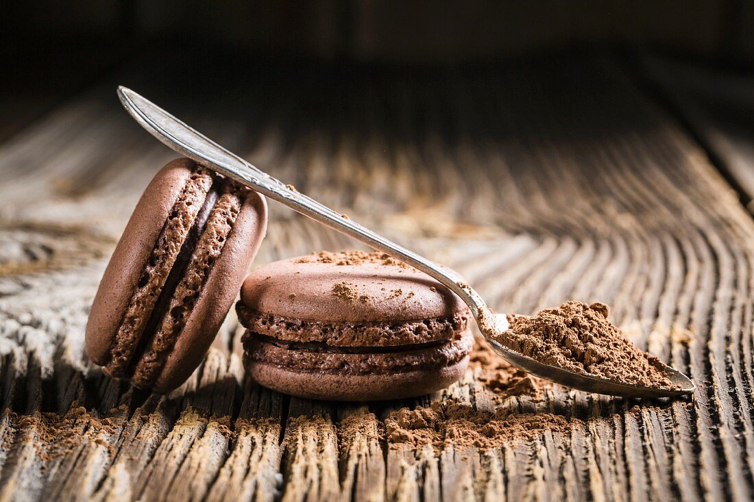 Chocolate macaroons on a wooden table