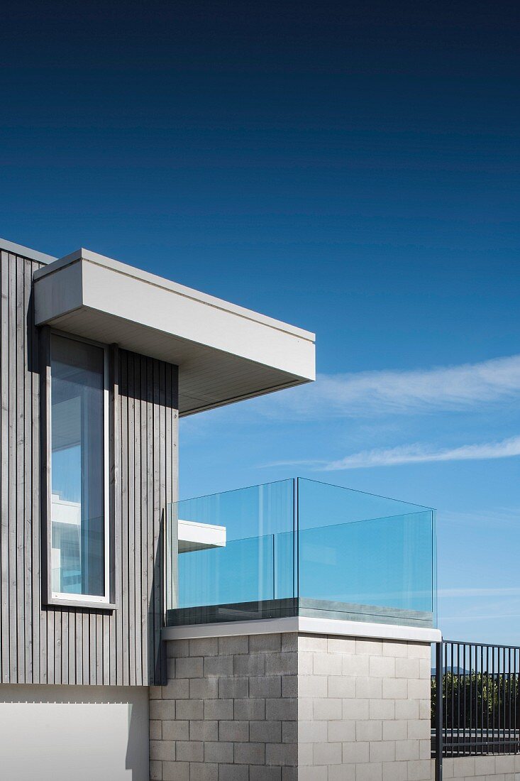 Contemporary house with glass balcony balustrade