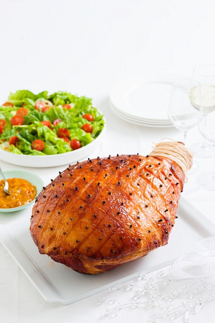 Glazed Christmas ham with a side salad