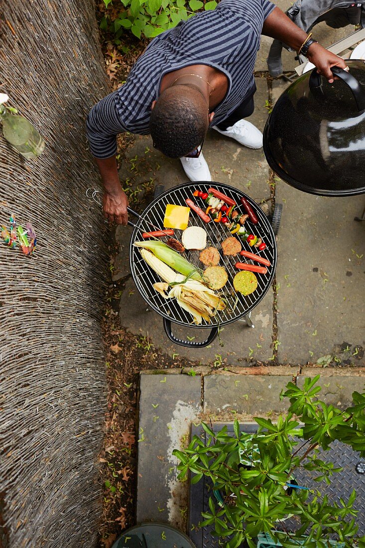 An African-American man at a barbecue (seen from above)