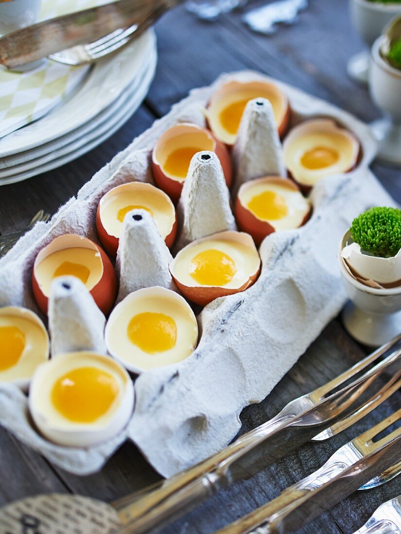 White chocolate mousse with peach slices in eggshells